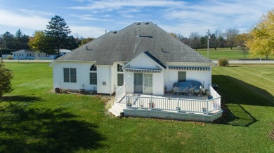 This stunning home situated on a well-manicured 1 acre lot is on Paw Paw Lake Golf Course in Michigan - for sale on GolfHomes.com, golf home, golf lot