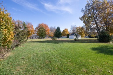 This stunning home situated on a well-manicured 1 acre lot is on Paw Paw Lake Golf Course in Michigan - for sale on GolfHomes.com, golf home, golf lot