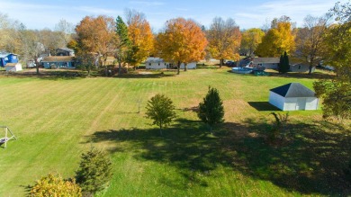 This stunning home situated on a well-manicured 1 acre lot is on Paw Paw Lake Golf Course in Michigan - for sale on GolfHomes.com, golf home, golf lot