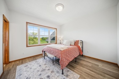 Set in a private, tree-lined location with a tranquil pond out on Golf at the Legacy in Minnesota - for sale on GolfHomes.com, golf home, golf lot
