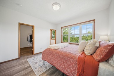 Set in a private, tree-lined location with a tranquil pond out on Golf at the Legacy in Minnesota - for sale on GolfHomes.com, golf home, golf lot
