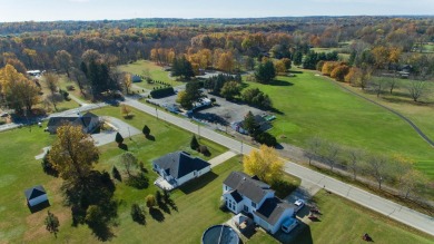 This stunning home situated on a well-manicured 1 acre lot is on Paw Paw Lake Golf Course in Michigan - for sale on GolfHomes.com, golf home, golf lot