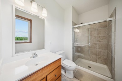 Set in a private, tree-lined location with a tranquil pond out on Golf at the Legacy in Minnesota - for sale on GolfHomes.com, golf home, golf lot
