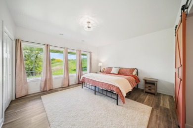 Set in a private, tree-lined location with a tranquil pond out on Golf at the Legacy in Minnesota - for sale on GolfHomes.com, golf home, golf lot