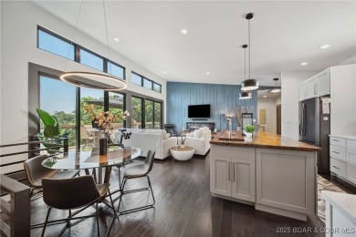 The views from this modernly constructed lakefront home are on Seasons Ridge At Four Seasons in Missouri - for sale on GolfHomes.com, golf home, golf lot