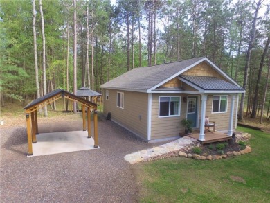 Not your average cottage! This 2023 built Timberland Cottage has on Voyager Village Country Club - Voyager in Wisconsin - for sale on GolfHomes.com, golf home, golf lot