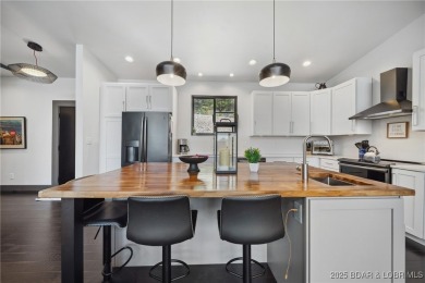 The views from this modernly constructed lakefront home are on Seasons Ridge At Four Seasons in Missouri - for sale on GolfHomes.com, golf home, golf lot