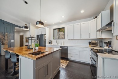 The views from this modernly constructed lakefront home are on Seasons Ridge At Four Seasons in Missouri - for sale on GolfHomes.com, golf home, golf lot