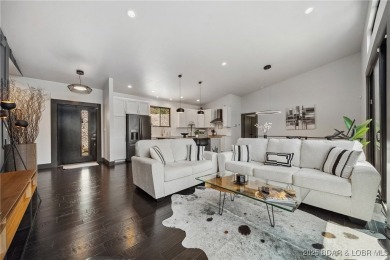 The views from this modernly constructed lakefront home are on Seasons Ridge At Four Seasons in Missouri - for sale on GolfHomes.com, golf home, golf lot