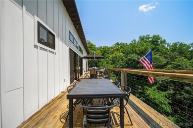 The views from this modernly constructed lakefront home are on Seasons Ridge At Four Seasons in Missouri - for sale on GolfHomes.com, golf home, golf lot
