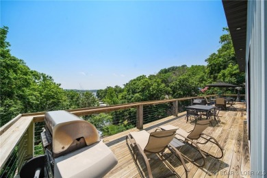 The views from this modernly constructed lakefront home are on Seasons Ridge At Four Seasons in Missouri - for sale on GolfHomes.com, golf home, golf lot