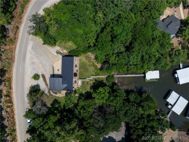 The views from this modernly constructed lakefront home are on Seasons Ridge At Four Seasons in Missouri - for sale on GolfHomes.com, golf home, golf lot