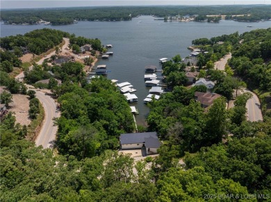 The views from this modernly constructed lakefront home are on Seasons Ridge At Four Seasons in Missouri - for sale on GolfHomes.com, golf home, golf lot