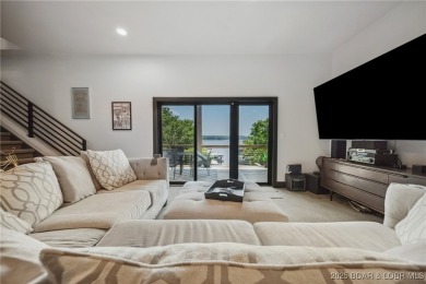 The views from this modernly constructed lakefront home are on Seasons Ridge At Four Seasons in Missouri - for sale on GolfHomes.com, golf home, golf lot