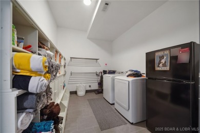 The views from this modernly constructed lakefront home are on Seasons Ridge At Four Seasons in Missouri - for sale on GolfHomes.com, golf home, golf lot