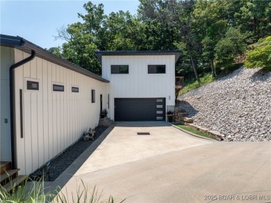 The views from this modernly constructed lakefront home are on Seasons Ridge At Four Seasons in Missouri - for sale on GolfHomes.com, golf home, golf lot