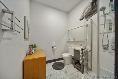 The views from this modernly constructed lakefront home are on Seasons Ridge At Four Seasons in Missouri - for sale on GolfHomes.com, golf home, golf lot