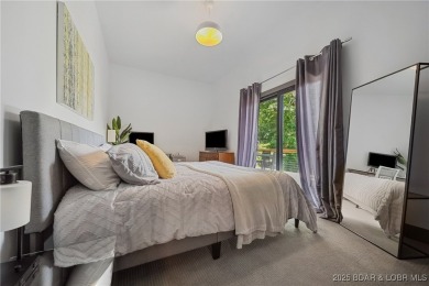 The views from this modernly constructed lakefront home are on Seasons Ridge At Four Seasons in Missouri - for sale on GolfHomes.com, golf home, golf lot