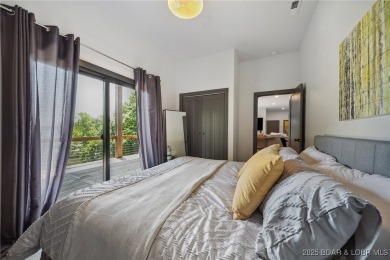 The views from this modernly constructed lakefront home are on Seasons Ridge At Four Seasons in Missouri - for sale on GolfHomes.com, golf home, golf lot