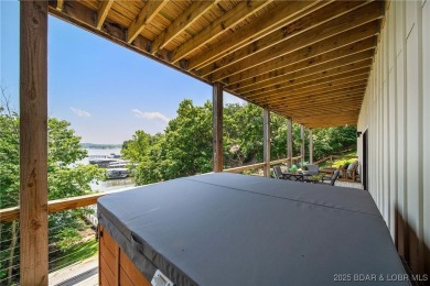 The views from this modernly constructed lakefront home are on Seasons Ridge At Four Seasons in Missouri - for sale on GolfHomes.com, golf home, golf lot