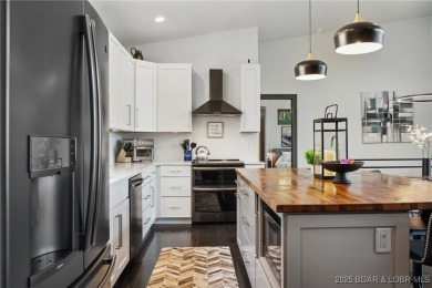 The views from this modernly constructed lakefront home are on Seasons Ridge At Four Seasons in Missouri - for sale on GolfHomes.com, golf home, golf lot