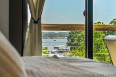 The views from this modernly constructed lakefront home are on Seasons Ridge At Four Seasons in Missouri - for sale on GolfHomes.com, golf home, golf lot