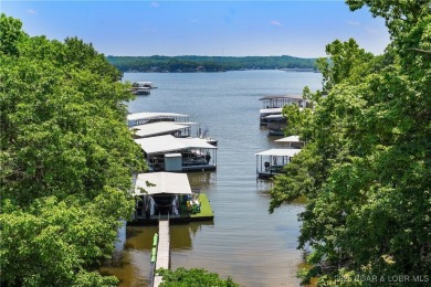 The views from this modernly constructed lakefront home are on Seasons Ridge At Four Seasons in Missouri - for sale on GolfHomes.com, golf home, golf lot