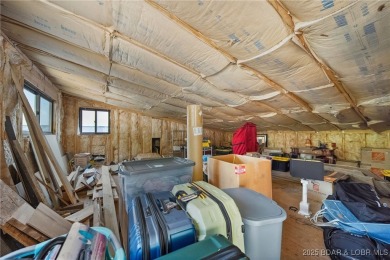 The views from this modernly constructed lakefront home are on Seasons Ridge At Four Seasons in Missouri - for sale on GolfHomes.com, golf home, golf lot