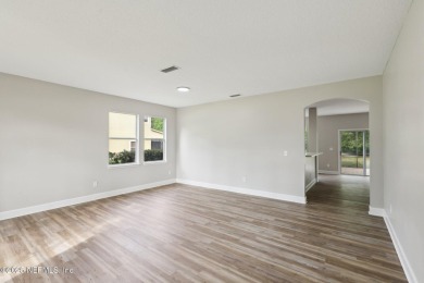 Welcome to this inviting home in Chatham Village at Fleming on Golf Club At Fleming Island in Florida - for sale on GolfHomes.com, golf home, golf lot