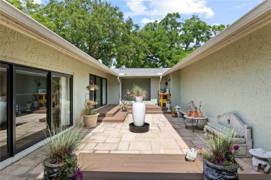 Architectural Gem in Sought-After Phase 1 of Carrollwood Village on Emerald Greens Golf Resort and Country Club in Florida - for sale on GolfHomes.com, golf home, golf lot