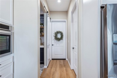 Welcome to this beautifully designed 2022 custom-built home on Desert Lakes Golf Course in Arizona - for sale on GolfHomes.com, golf home, golf lot