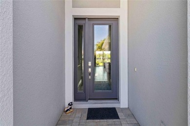 This beautifully enhanced WATER VIEW Augusta model set within on Rosedale Golf and Tennis Club in Florida - for sale on GolfHomes.com, golf home, golf lot