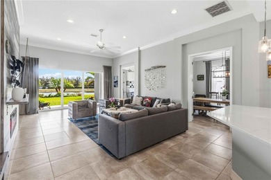This beautifully enhanced WATER VIEW Augusta model set within on Rosedale Golf and Tennis Club in Florida - for sale on GolfHomes.com, golf home, golf lot