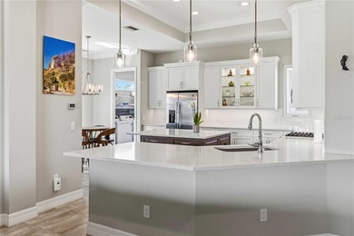 This beautifully enhanced WATER VIEW Augusta model set within on Rosedale Golf and Tennis Club in Florida - for sale on GolfHomes.com, golf home, golf lot