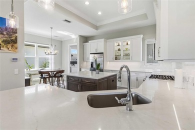 This beautifully enhanced WATER VIEW Augusta model set within on Rosedale Golf and Tennis Club in Florida - for sale on GolfHomes.com, golf home, golf lot