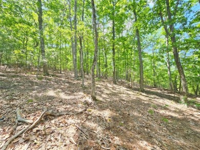 Nestled within the serene and exclusive Big Canoe community in on Big Canoe Golf Club - Cherokee in Georgia - for sale on GolfHomes.com, golf home, golf lot