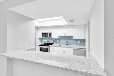 This beautifully updated 3-bedroom, 2-bath single-family home is on East Lake Woodlands Country Club in Florida - for sale on GolfHomes.com, golf home, golf lot