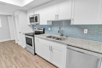 This beautifully updated 3-bedroom, 2-bath single-family home is on East Lake Woodlands Country Club in Florida - for sale on GolfHomes.com, golf home, golf lot