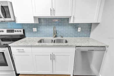 This beautifully updated 3-bedroom, 2-bath single-family home is on East Lake Woodlands Country Club in Florida - for sale on GolfHomes.com, golf home, golf lot