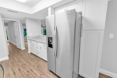 This beautifully updated 3-bedroom, 2-bath single-family home is on East Lake Woodlands Country Club in Florida - for sale on GolfHomes.com, golf home, golf lot