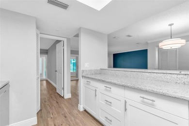 This beautifully updated 3-bedroom, 2-bath single-family home is on East Lake Woodlands Country Club in Florida - for sale on GolfHomes.com, golf home, golf lot