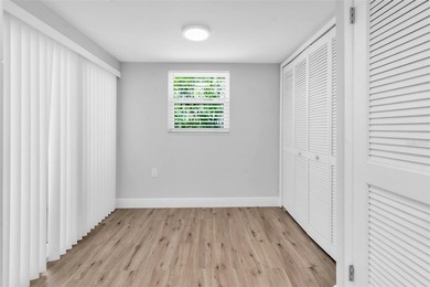 This beautifully updated 3-bedroom, 2-bath single-family home is on East Lake Woodlands Country Club in Florida - for sale on GolfHomes.com, golf home, golf lot