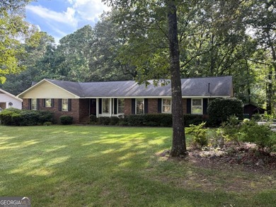 This 4 bedroom, 3 bath ranch has perfect bones and a great floor on Cherokee Golf and Country Club in Georgia - for sale on GolfHomes.com, golf home, golf lot