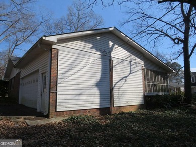 This 4 bedroom, 3 bath ranch has perfect bones and a great floor on Cherokee Golf and Country Club in Georgia - for sale on GolfHomes.com, golf home, golf lot