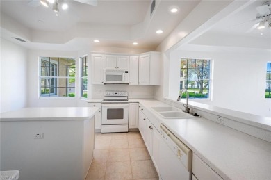 A Sought-after Berkeley model coach home with tranquil lake on Kensington Golf and Country Club in Florida - for sale on GolfHomes.com, golf home, golf lot