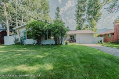 Discover the ease of single-floor living in this delightful on Ranch at Roaring Fork Golf Course in Colorado - for sale on GolfHomes.com, golf home, golf lot