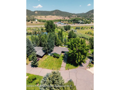 Discover the ease of single-floor living in this delightful on Ranch at Roaring Fork Golf Course in Colorado - for sale on GolfHomes.com, golf home, golf lot