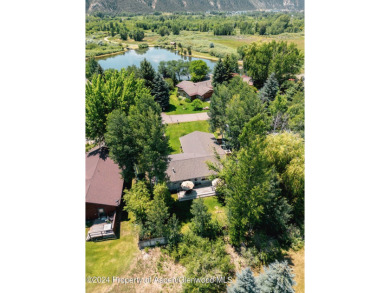 Discover the ease of single-floor living in this delightful on Ranch at Roaring Fork Golf Course in Colorado - for sale on GolfHomes.com, golf home, golf lot