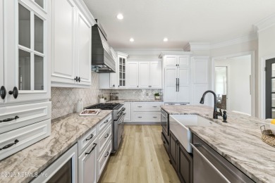 A magnificent WATERFRONT HOME in one of Florida's most coveted on Queens Harbour Yacht and Country Club in Florida - for sale on GolfHomes.com, golf home, golf lot