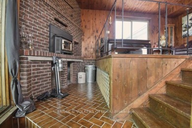 Charming side-split home on an oversized lot, ideally located on Dundas Valley Golf and Curling Club in  - for sale on GolfHomes.com, golf home, golf lot